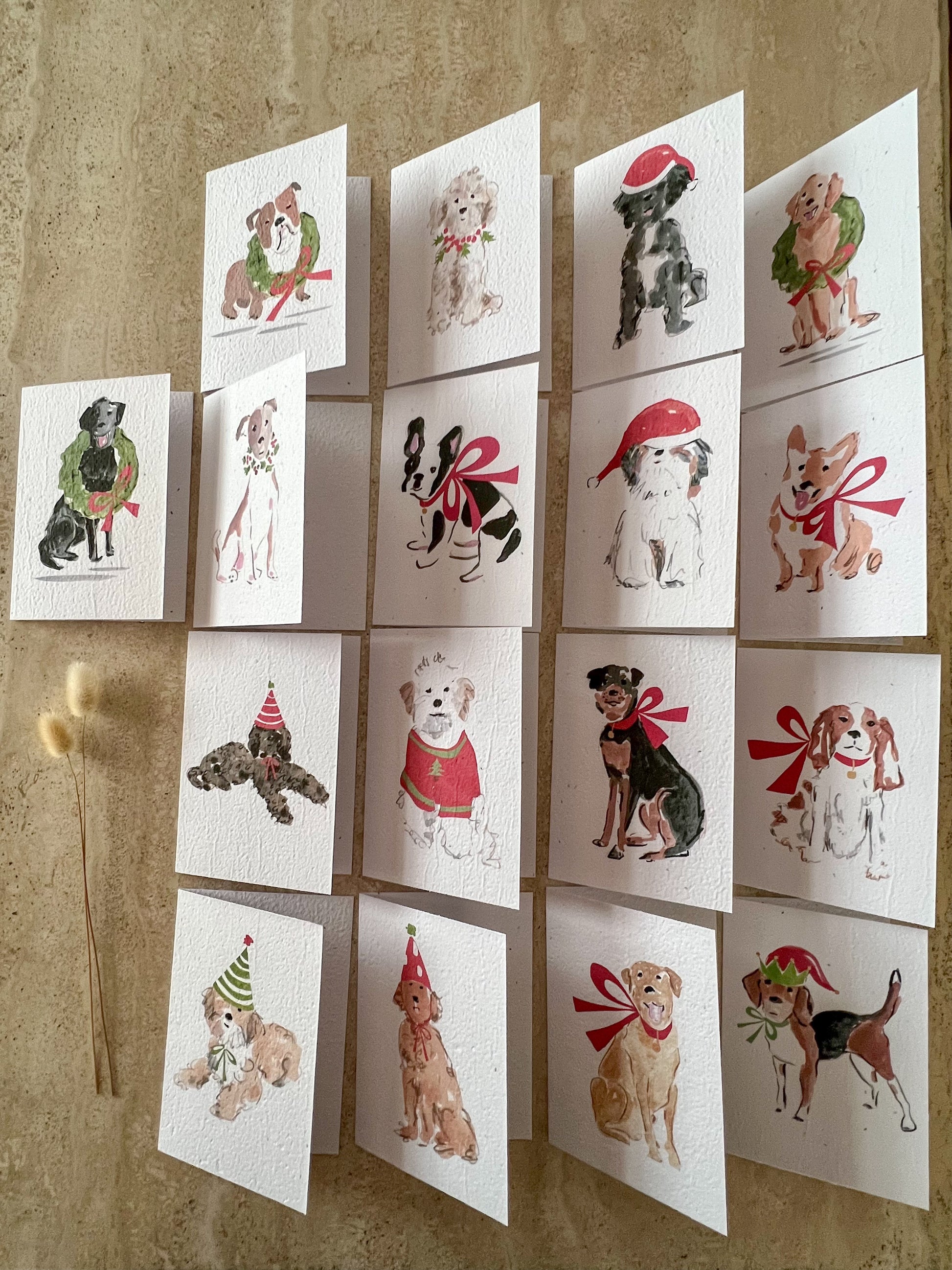 Set of plantable seeded greeting cards with illustrations of dogs wearing festive clothing by willow & sage co.