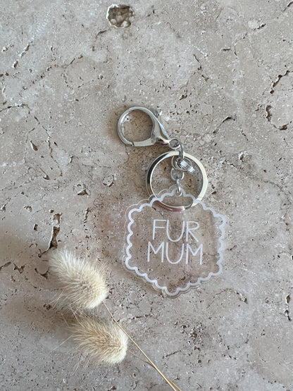 Keychain with 'Fur Mum' keychain on a textured surface