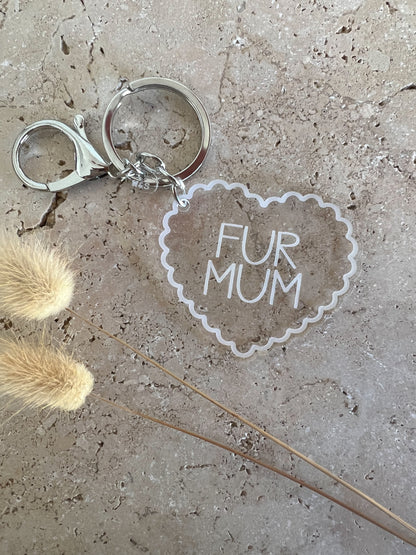 Keychain with 'FUR MUM' tag on a textured surface