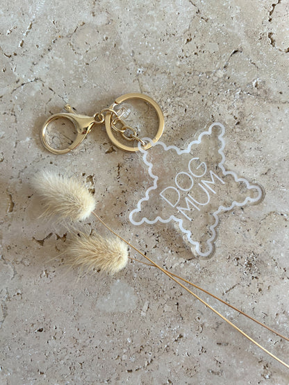 Keychain with 'Dog Mum' star charm on a textured surface